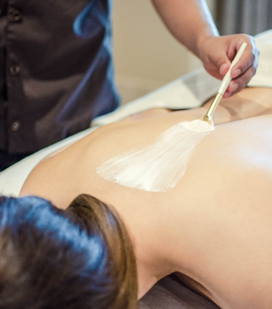 Spa relaxation lounge with natural stone and warm lighting